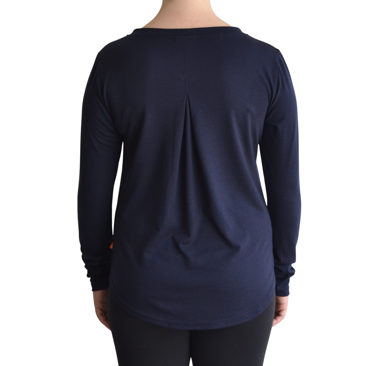 Links long sleeve merino top in navy blue colour, model faces away so the back is showing front on with a box pleat and scooped hemline.