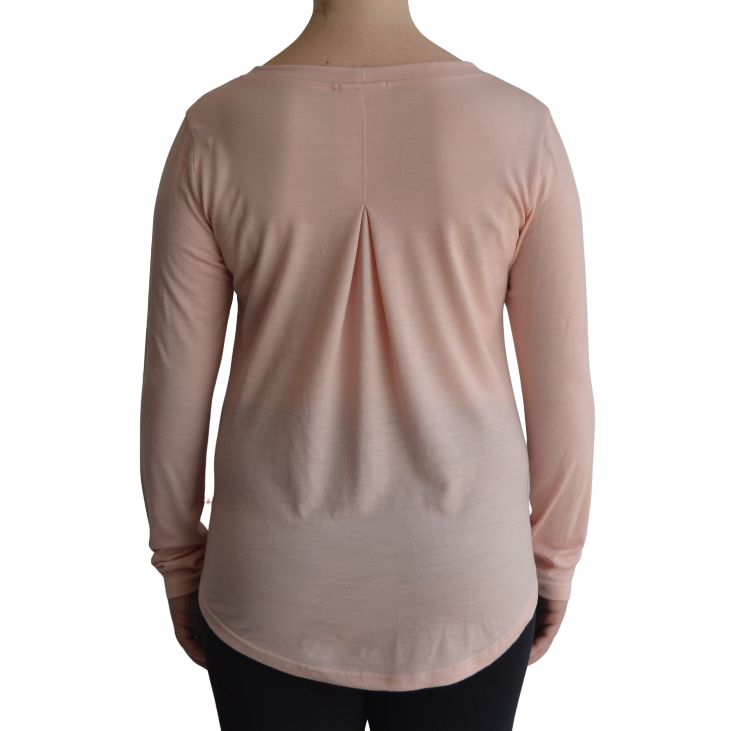 Links long sleeve merino top in petal light pink colour, model faces away so the back is showing front on with a box pleat and scooped hemline.