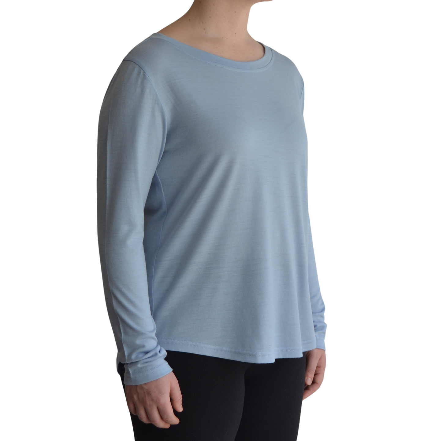 Links long sleeve merino top in ice blue colour. The model is standing on 45 degree angle facing forward