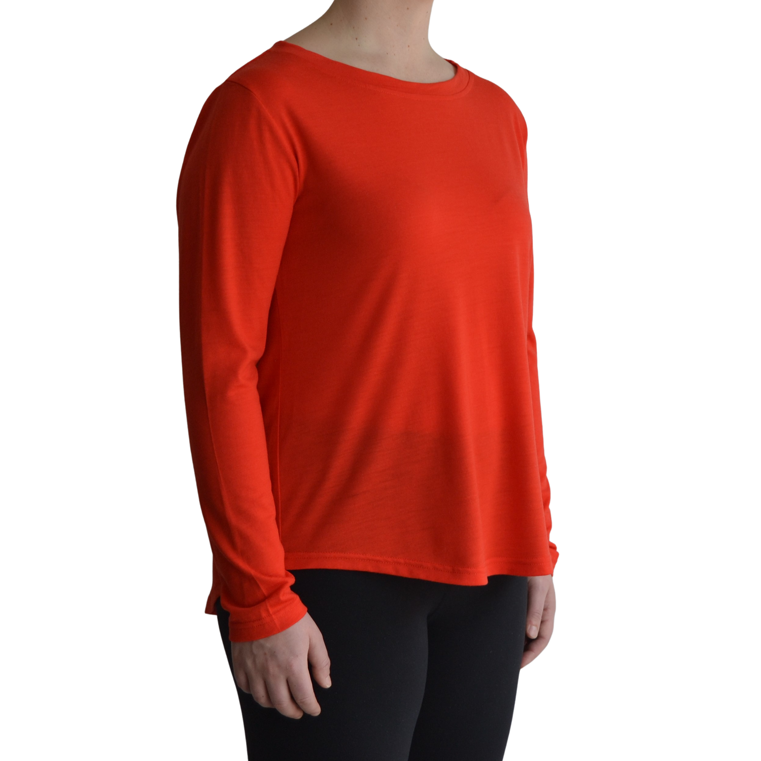 Links long sleeve merino top in mandarin colour. The model is standing on 45 degree angle facing forward