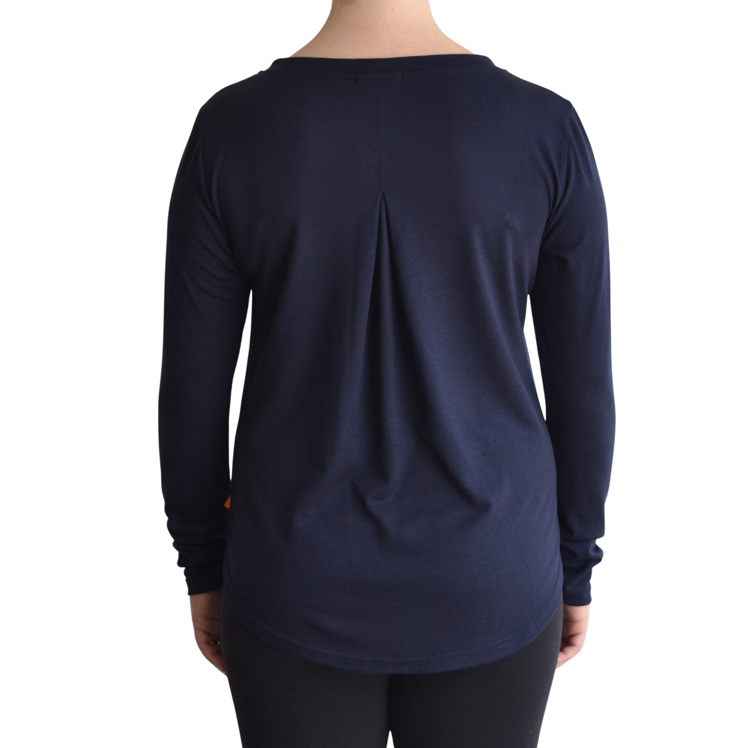 Links long sleeve merino top in navy blue colour, model faces away so the back is showing front on with a box pleat and scooped hemline. 