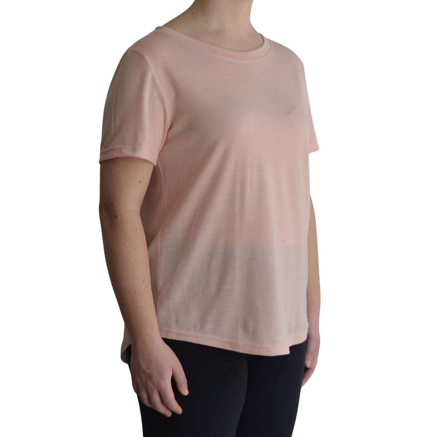 Links merino short sleeve t-shirt in petal light pink. Model faces forward on a 45 degree angle